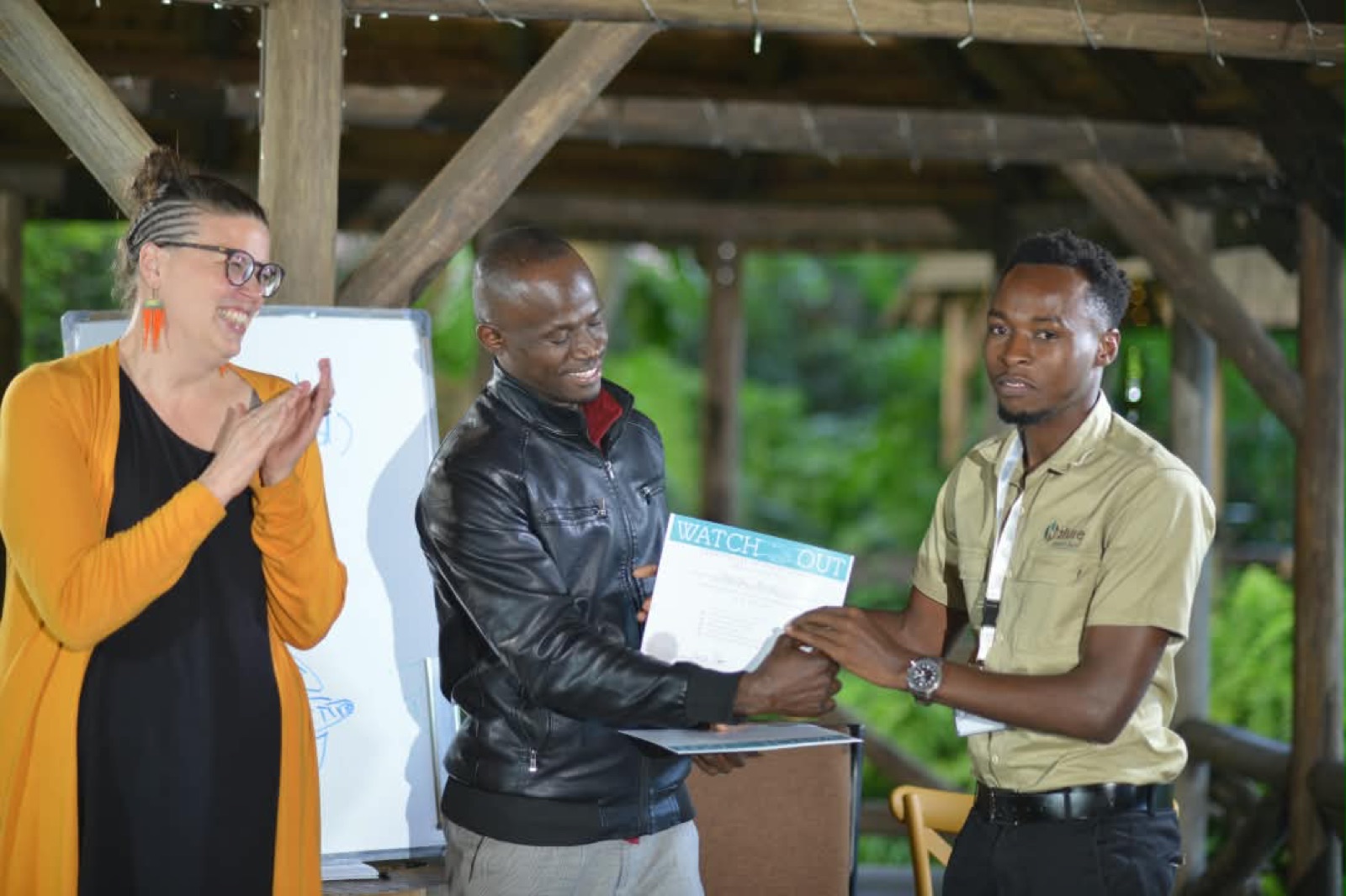 A certificate handover at the end of a WATCHOUT program